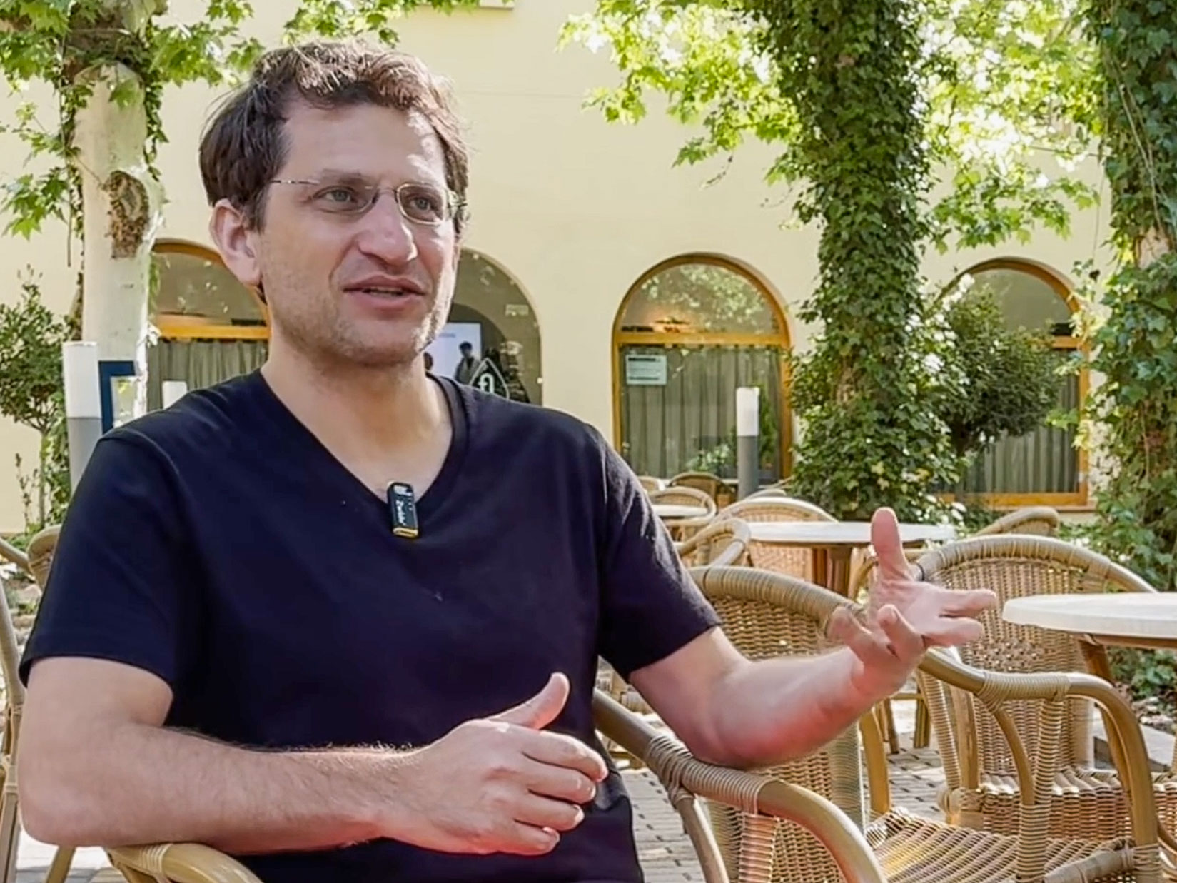 Adam Gries being interviewed outdoors at Longevity State Conference